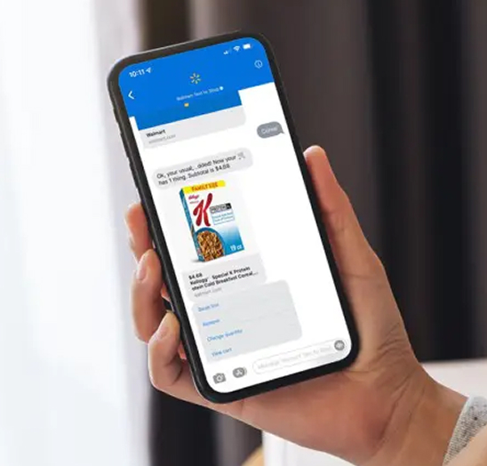 A hand holding a smartphone displaying the Hyphae app interface